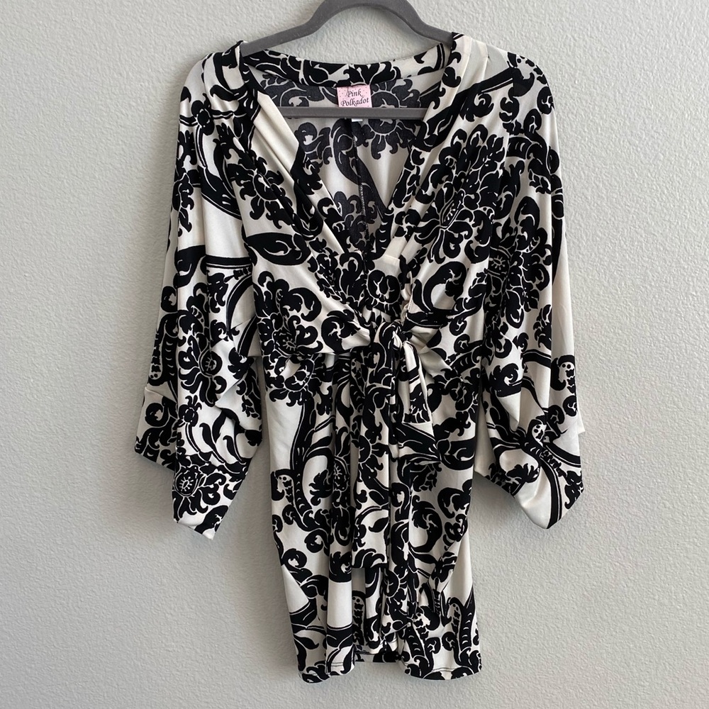 Gorgeous Ivory dress with Black Jaquard print. Stretch jersey. Size Medium.